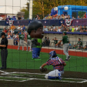 Entertainment by an inflatable character and one of the ball players during the Green Bay Booyah Baseball Game at Capital Credit Union Park in Ashwaubenon. SME members from both the senior chapter and the student chapter attended the game on June 29, 2019 in  which one of the inflatable characters began jostling with one of the players during a media timeout. 3028