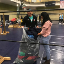 Members helping to bag up the extra coats at the end of the 32nd annual Coats for Kids Campaign. These extra coats will be put away until they are gotten out again for next year&#039;s coat distribution. 3026