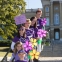 Find a photographer and plan out a specific spot for team photos on Walk day.