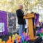 Great use of Promise Garden flowers on the stage and love to see a Walk back-drop and podium sign.